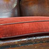 Set of 2 sheep leather wingback chairs with red corduroy seat cushions