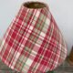 Wooden lamp and vintage red and green striped lampshade