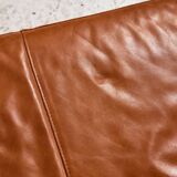 Ottoman with leather upholstery