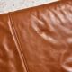 Ottoman with leather upholstery