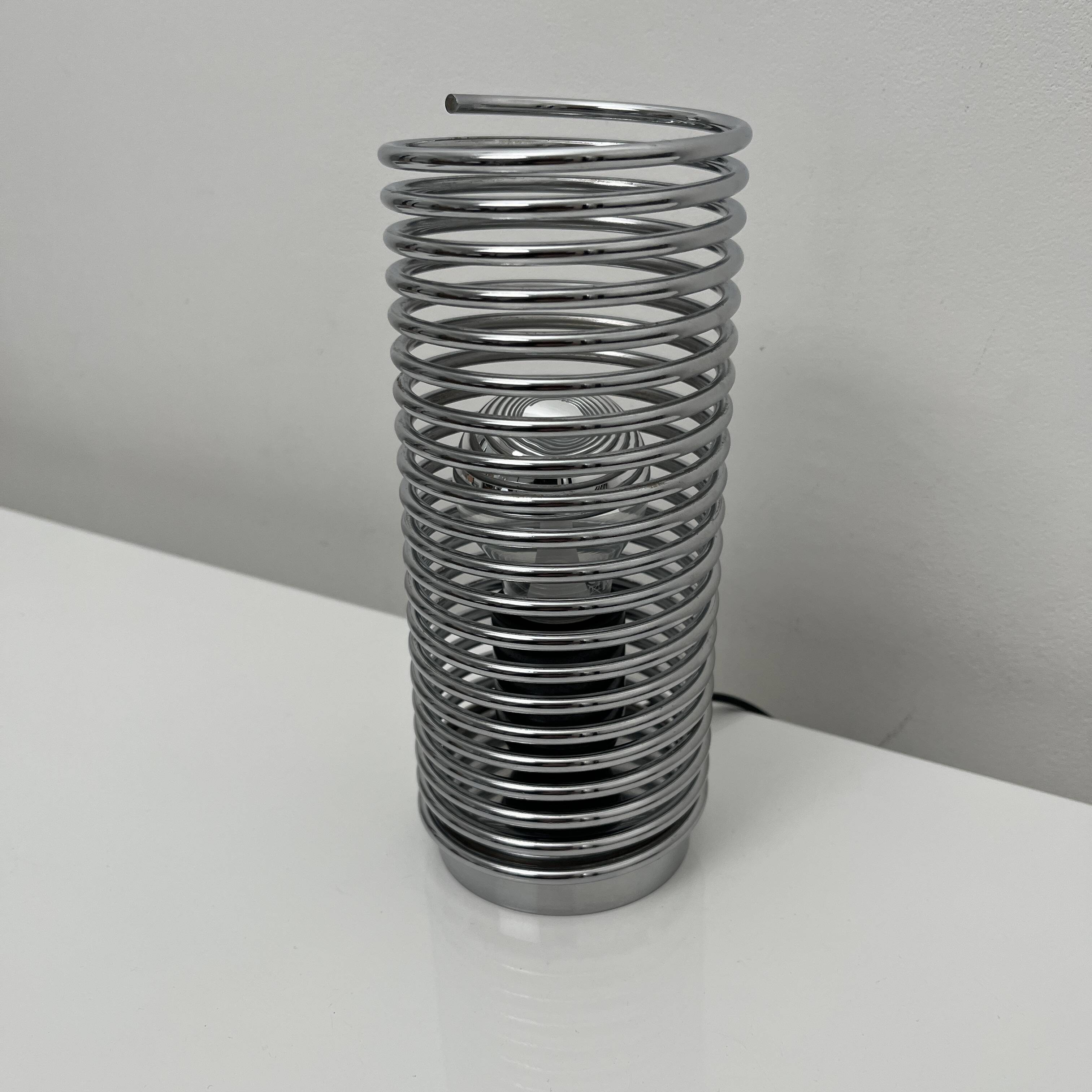 Massive chrome spring lamp