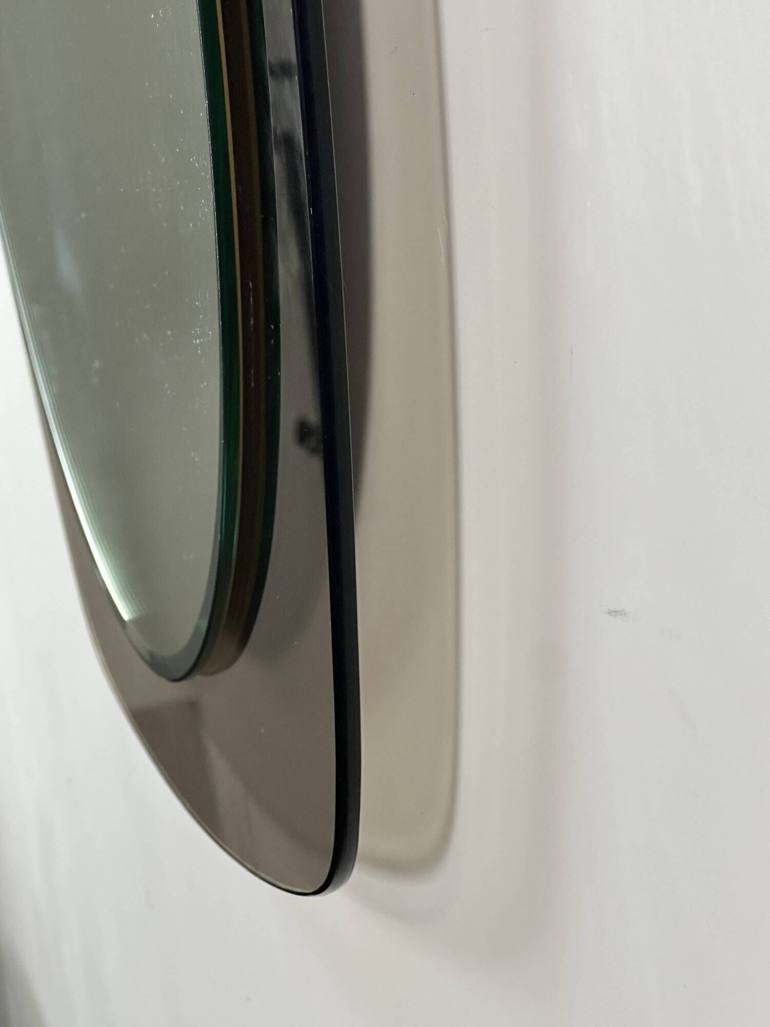 Vintage mirror with smoked glass frame from the 1970s.