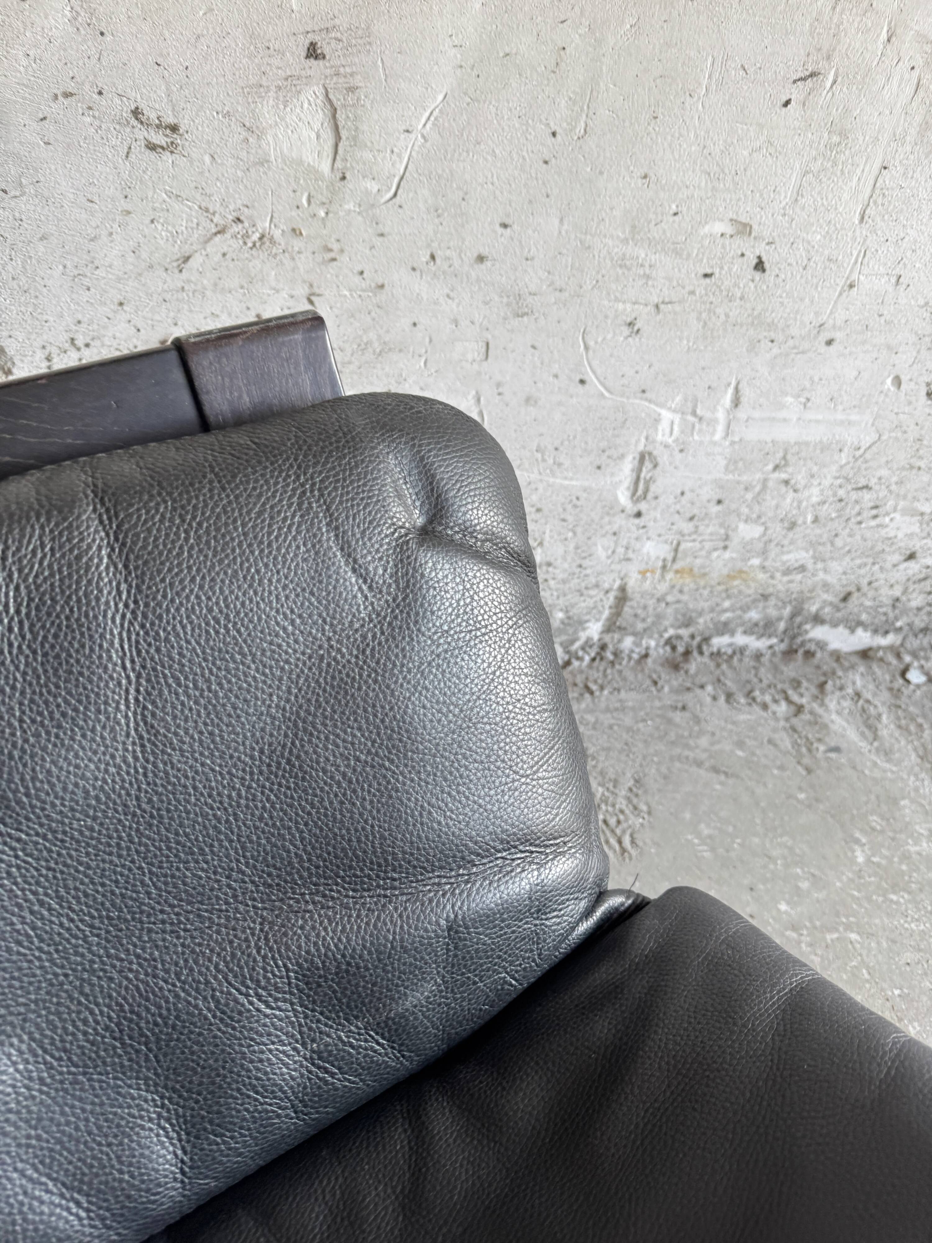 Vintage Scandinavian Black Leather Armchair with Ottoman — Solid Dark Wood Frame, Mid‑Century Modern