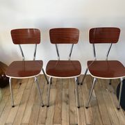 Trio of chairs in light brown formica and cream contour 70s