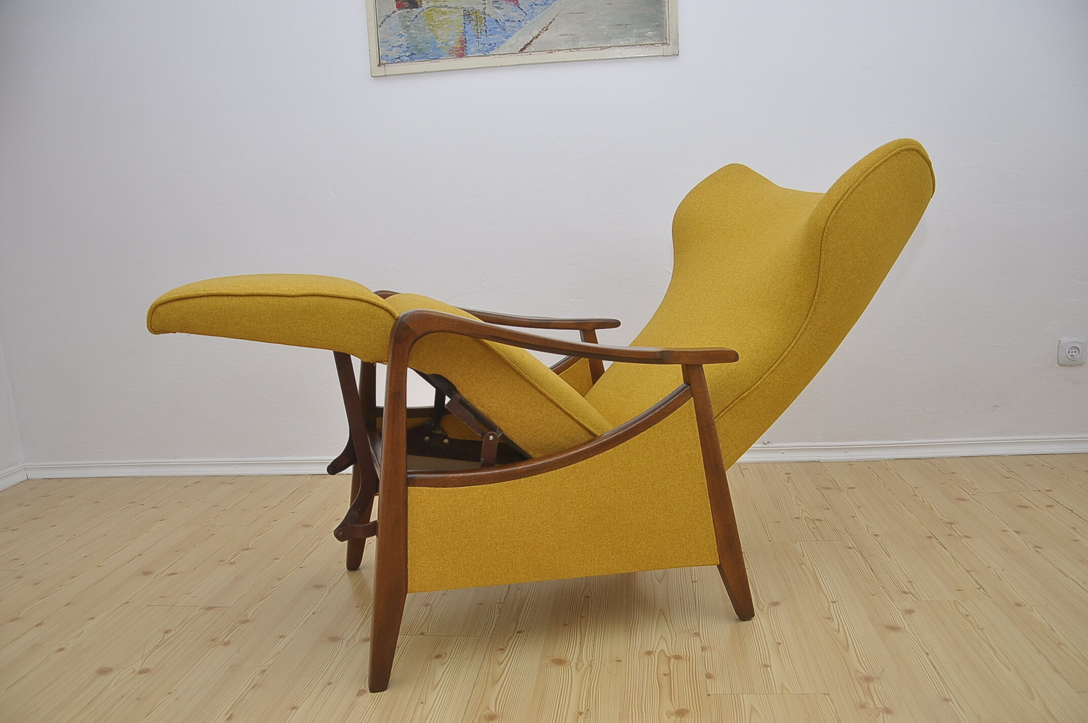 Mid-century Wingback armchair with folding footrest, 1960s