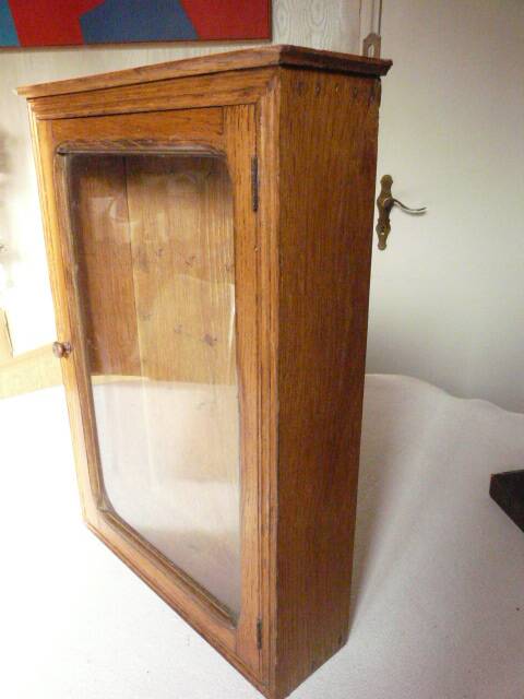 Old watchmaker's furniture wall display case