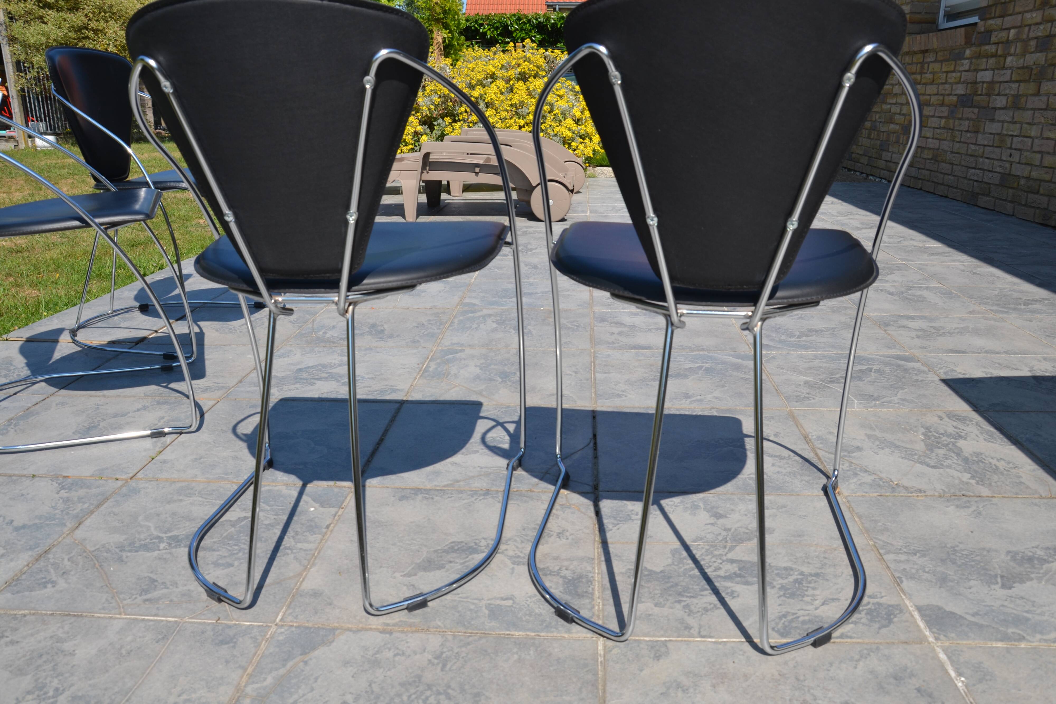 4 chrome and leather chairs designed by Italy