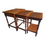 Nesting tables in solid cherry wood held together by slides