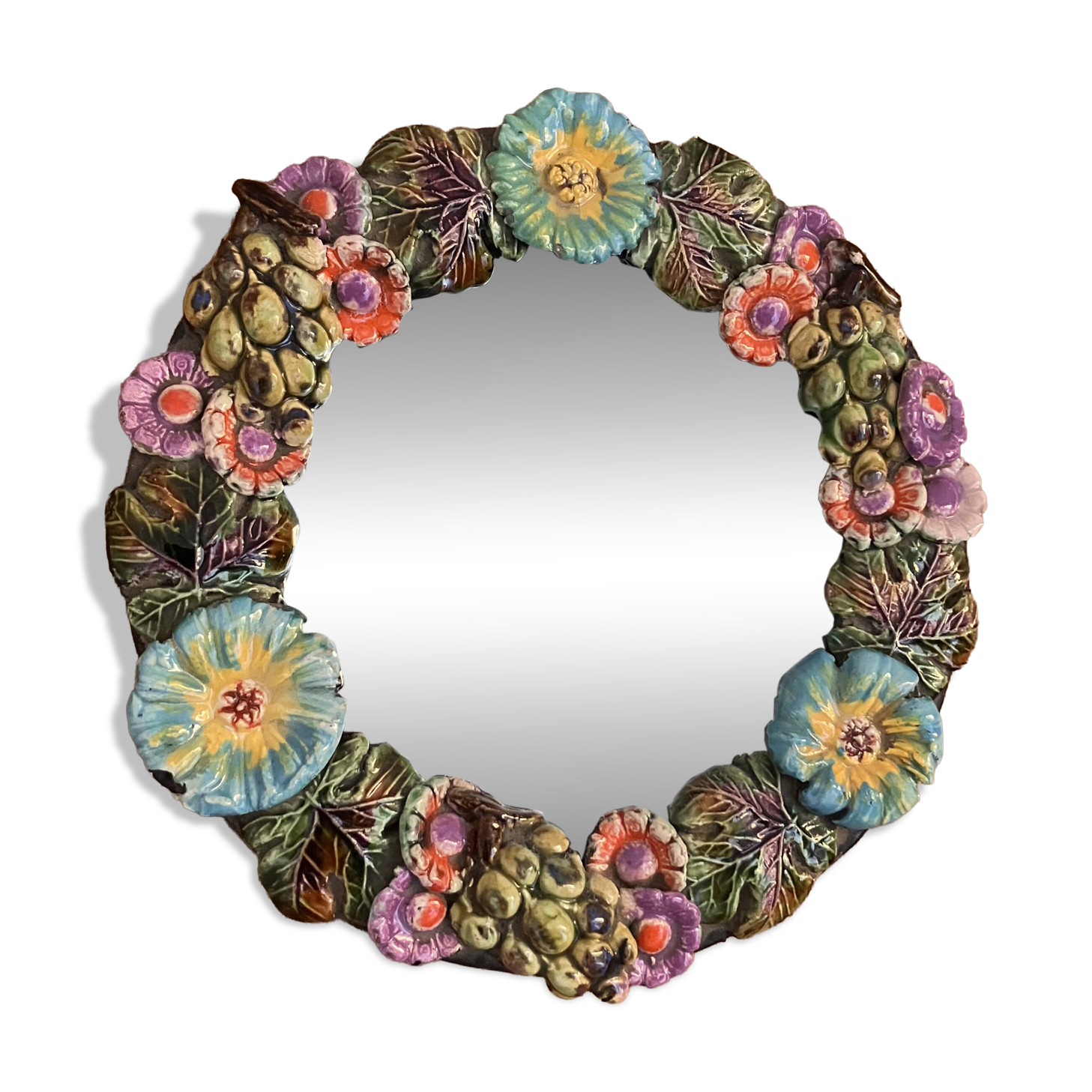 Round wall mirror in ceramic with slip-cast flowers, glazed, from the 60s/70s.