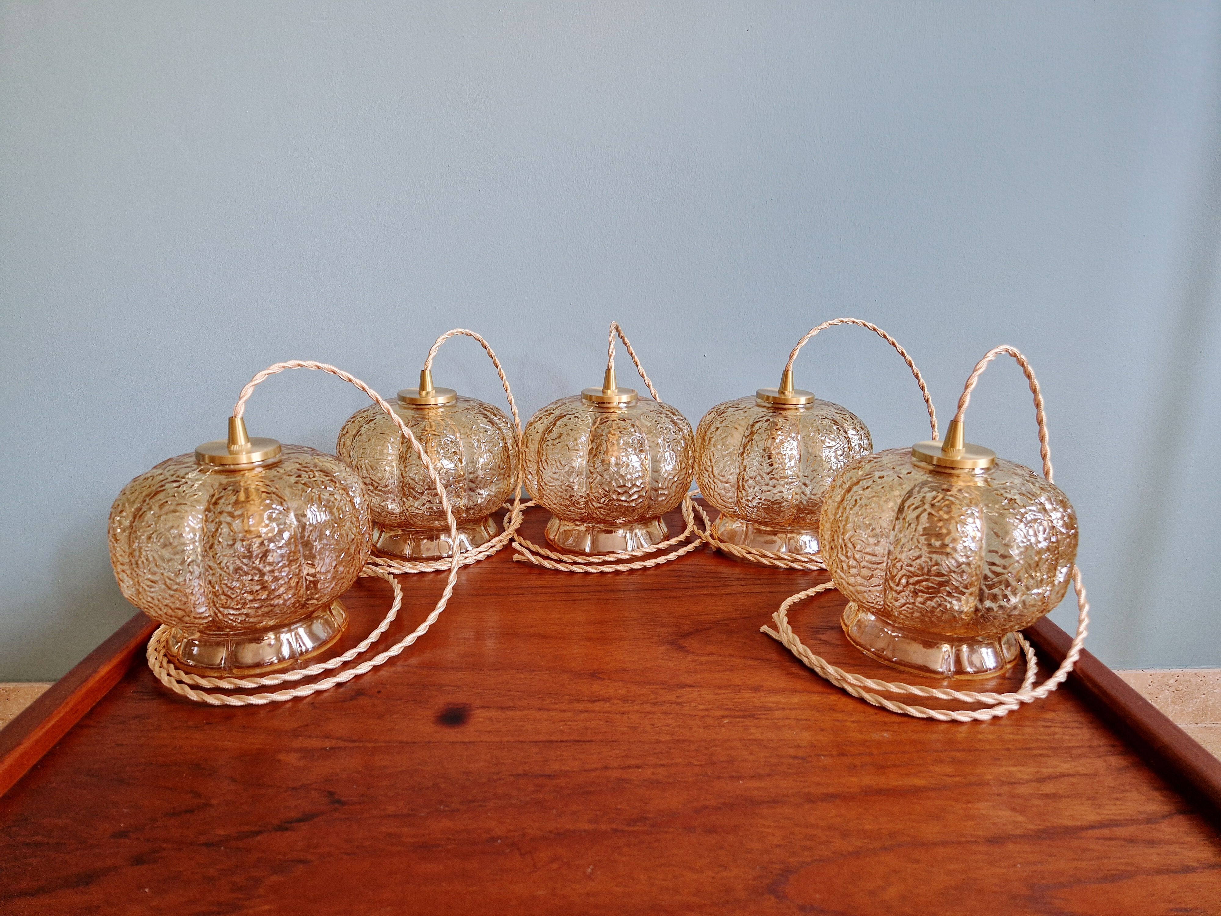 Vintage trio of amber glass pendants, 1960s-70s.