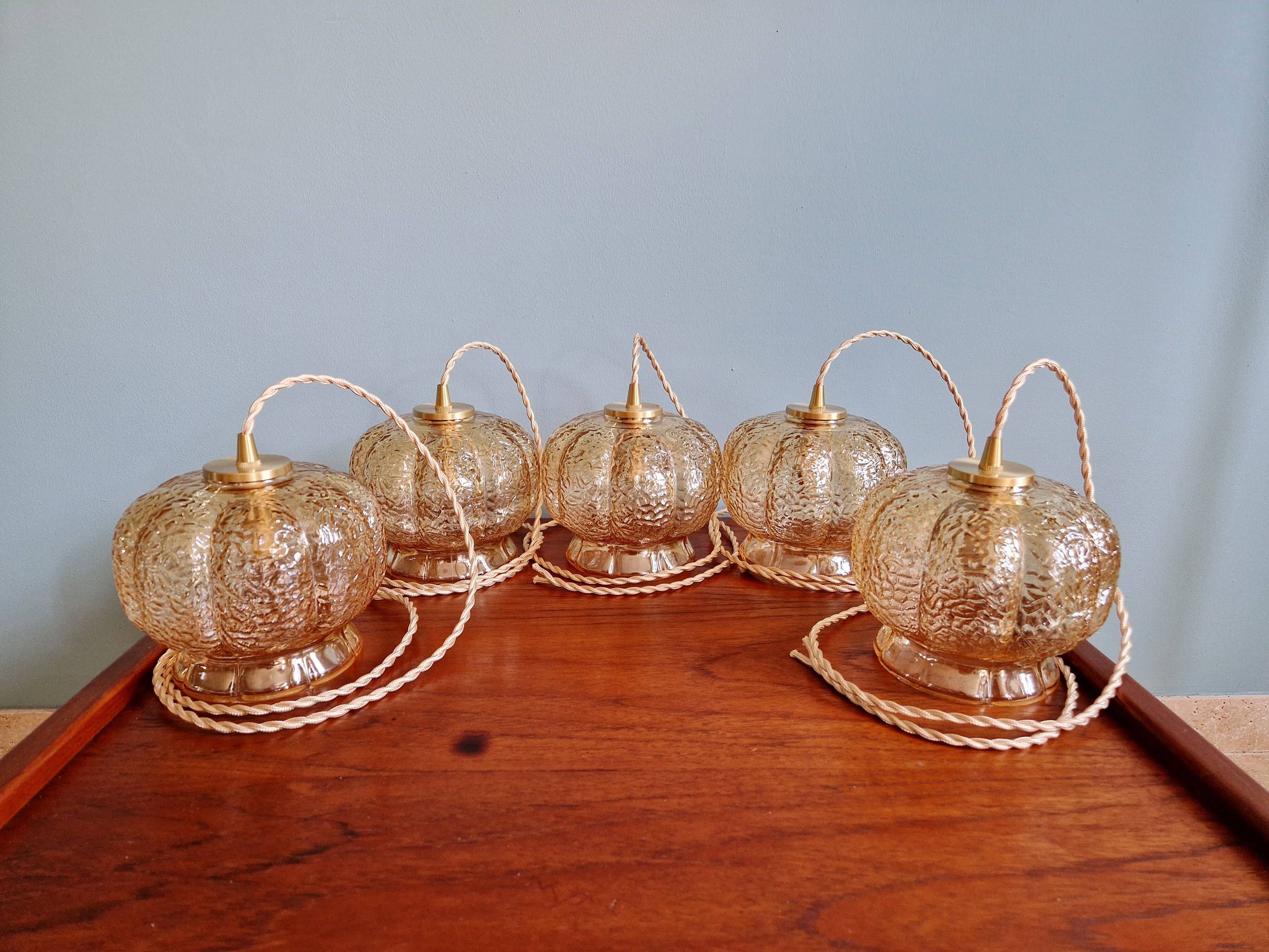 Vintage trio of amber glass pendants, 1960s-70s.