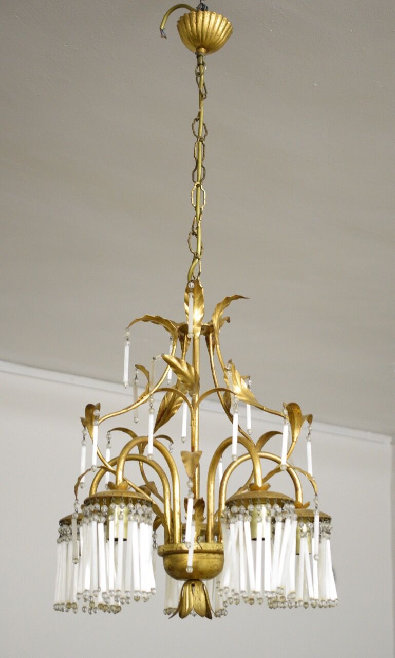 Golden metal chandelier in crystal pendants