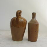 Set of two enamelled stoneware bottles.