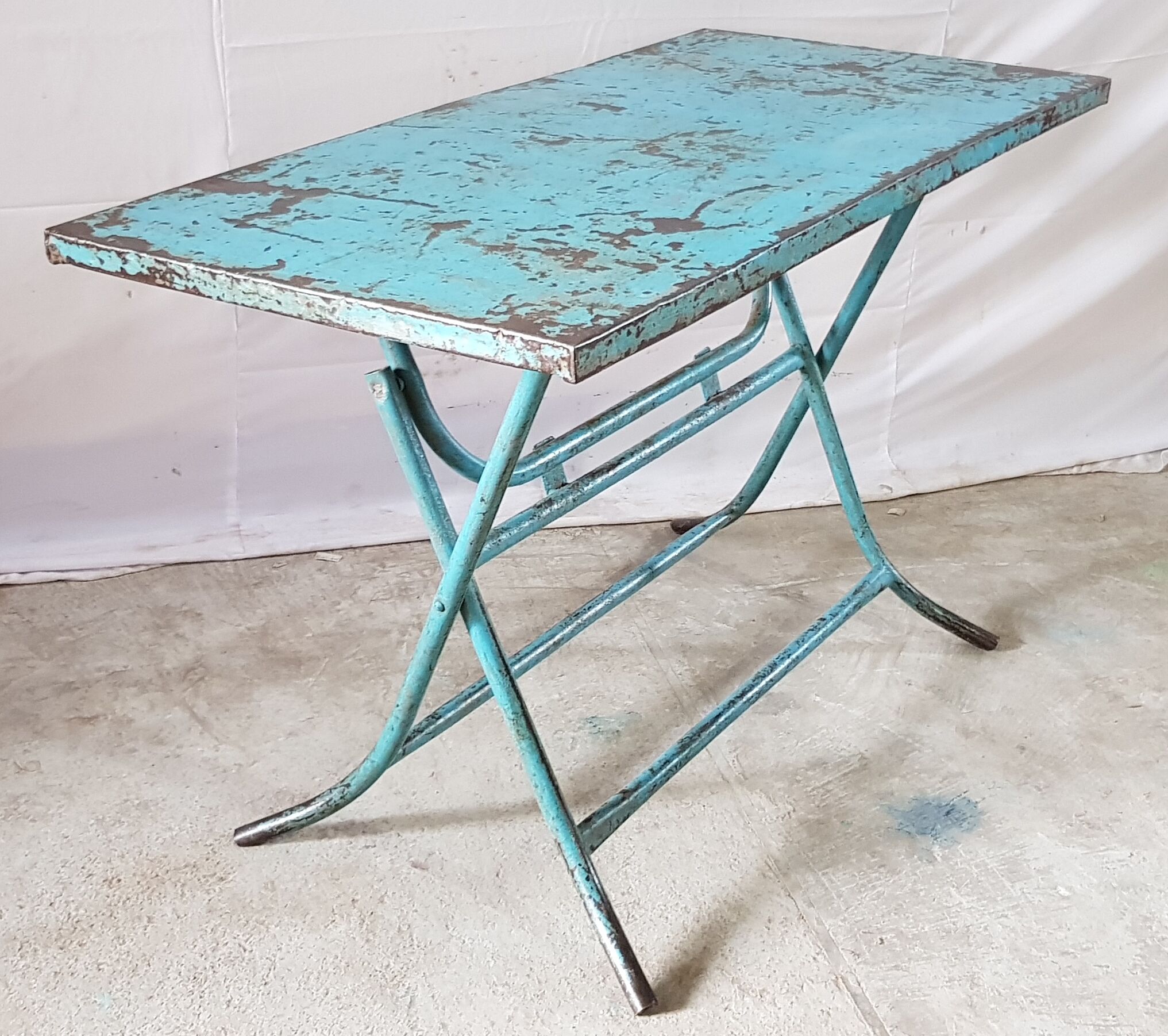 Old metal folding table with its original turquoise patina