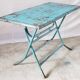 Old metal folding table with its original turquoise patina