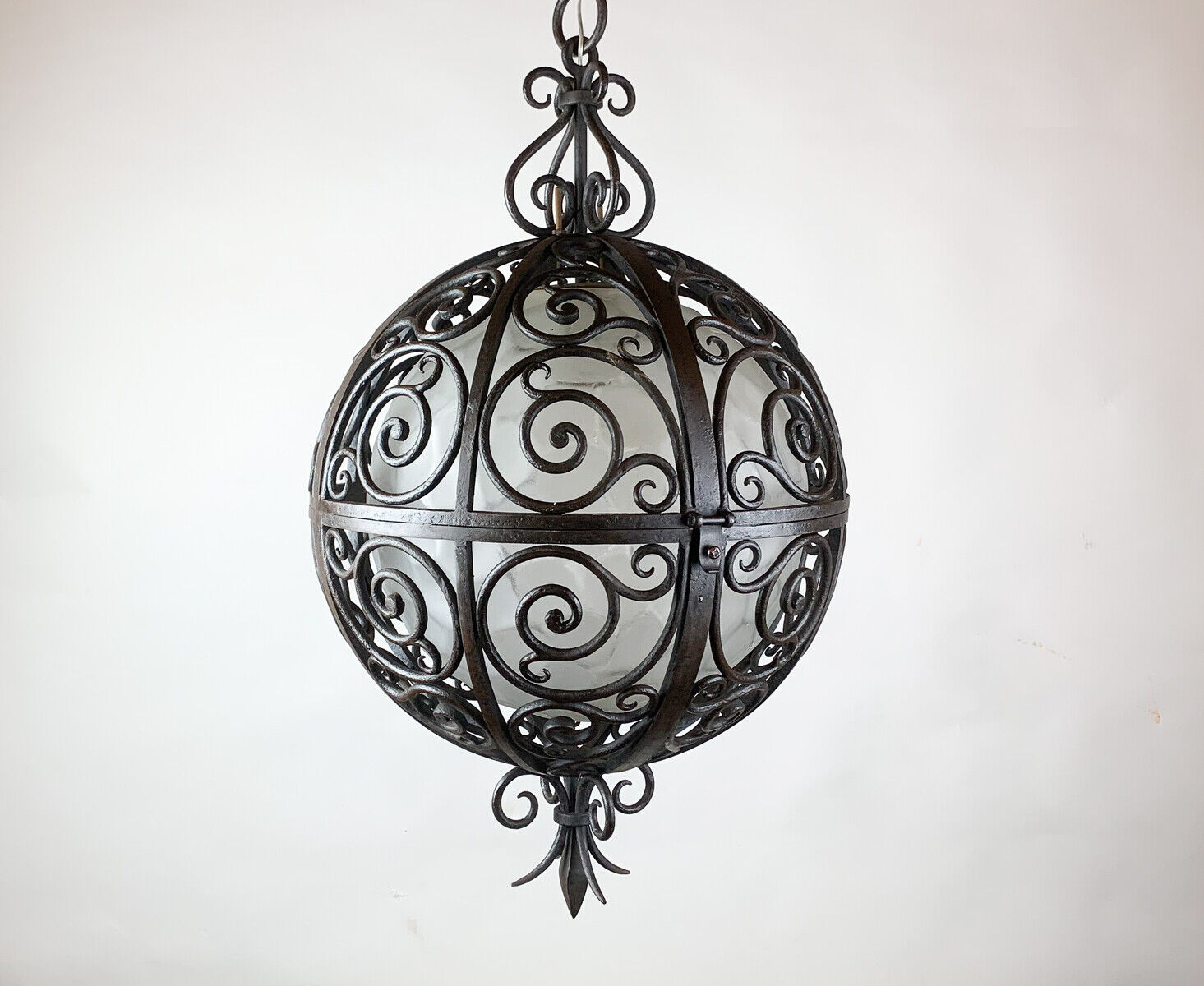 Wrought iron round suspension with interior glass sphere, c.1930