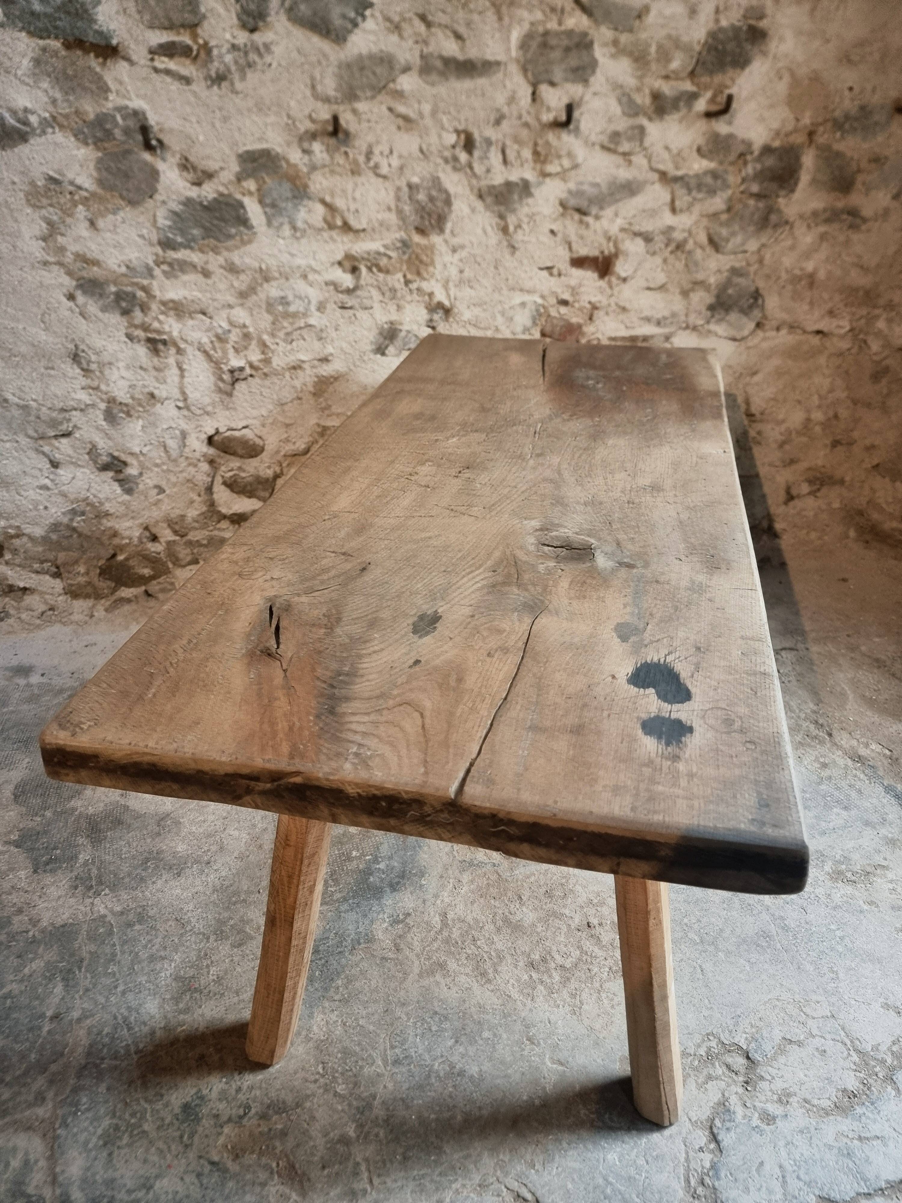 Antique work table / primitive dining table in oak, Hungary, circa 1900–1930.