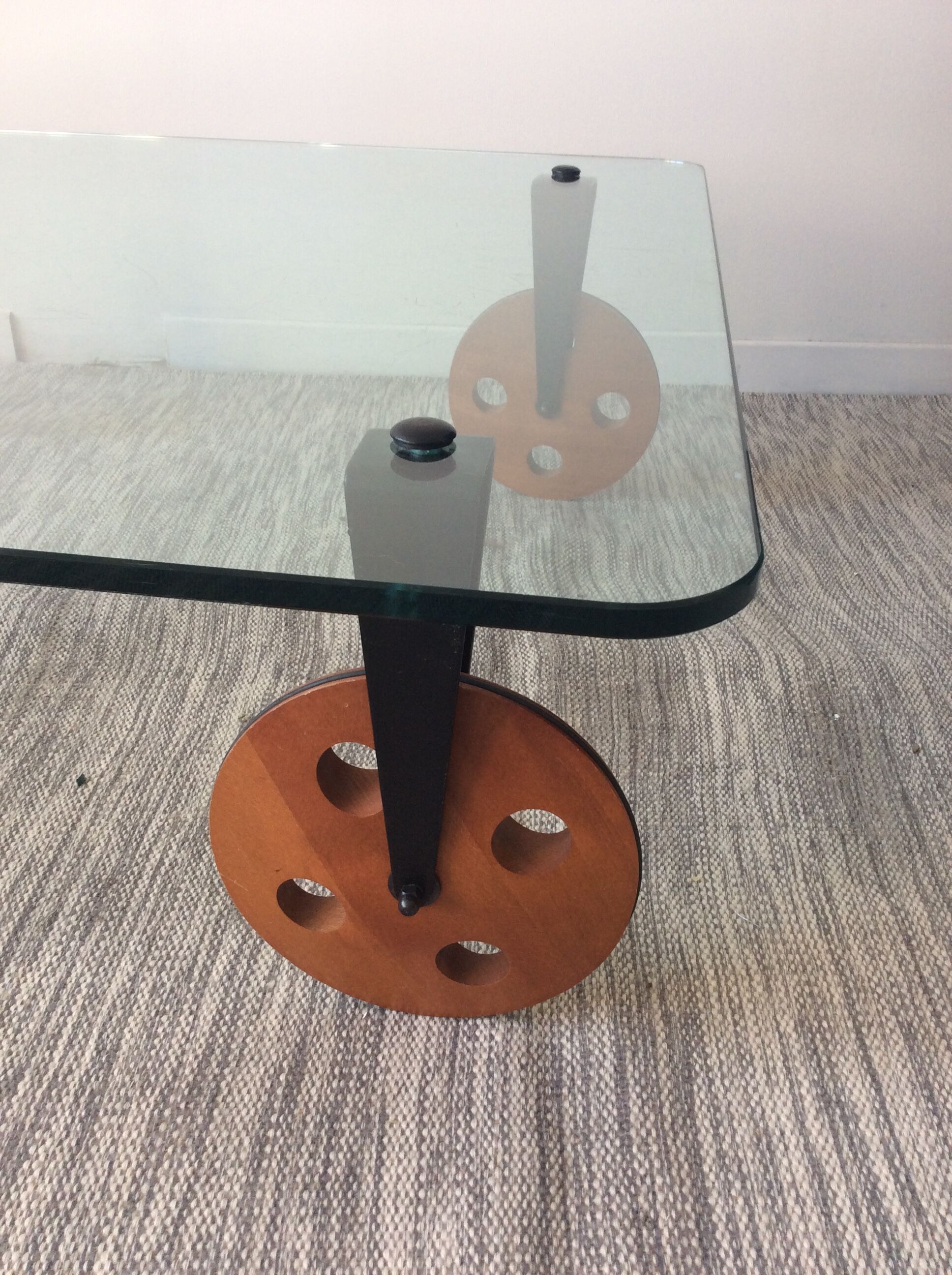 Glass coffee table on teak wheels