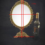Swivel table mirror in golden metal