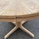 Scandinavian Baumann round extendable dining table with central leg, 115cm.