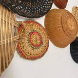 Wall composition of wicker baskets and trays.