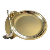 Round brass pocket tray with club and golf ball decoration.