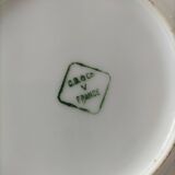 Two Art Deco porcelain cups and saucers with silver trim.