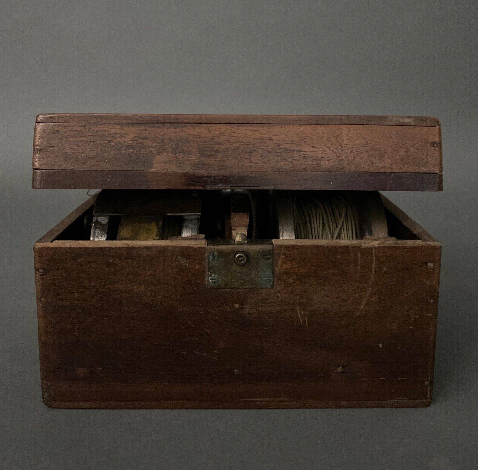 Two reel spools in their original 1900 box