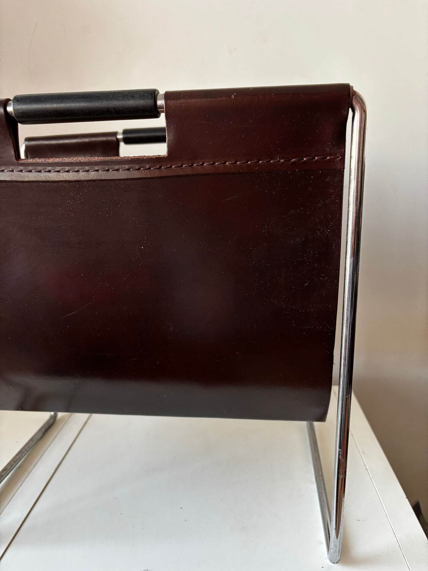 Leather and chrome magazine rack Brabantia