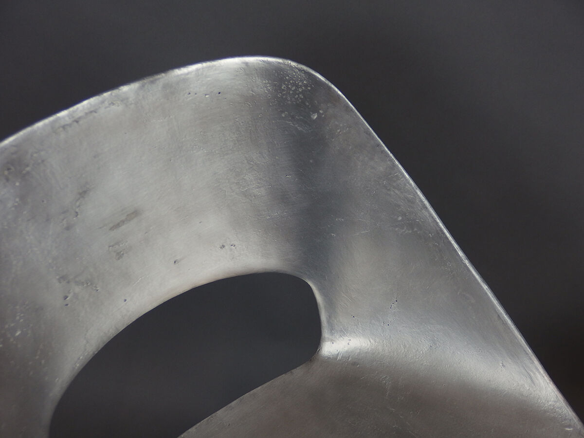 Four aluminium chairs by Pierre Guariche