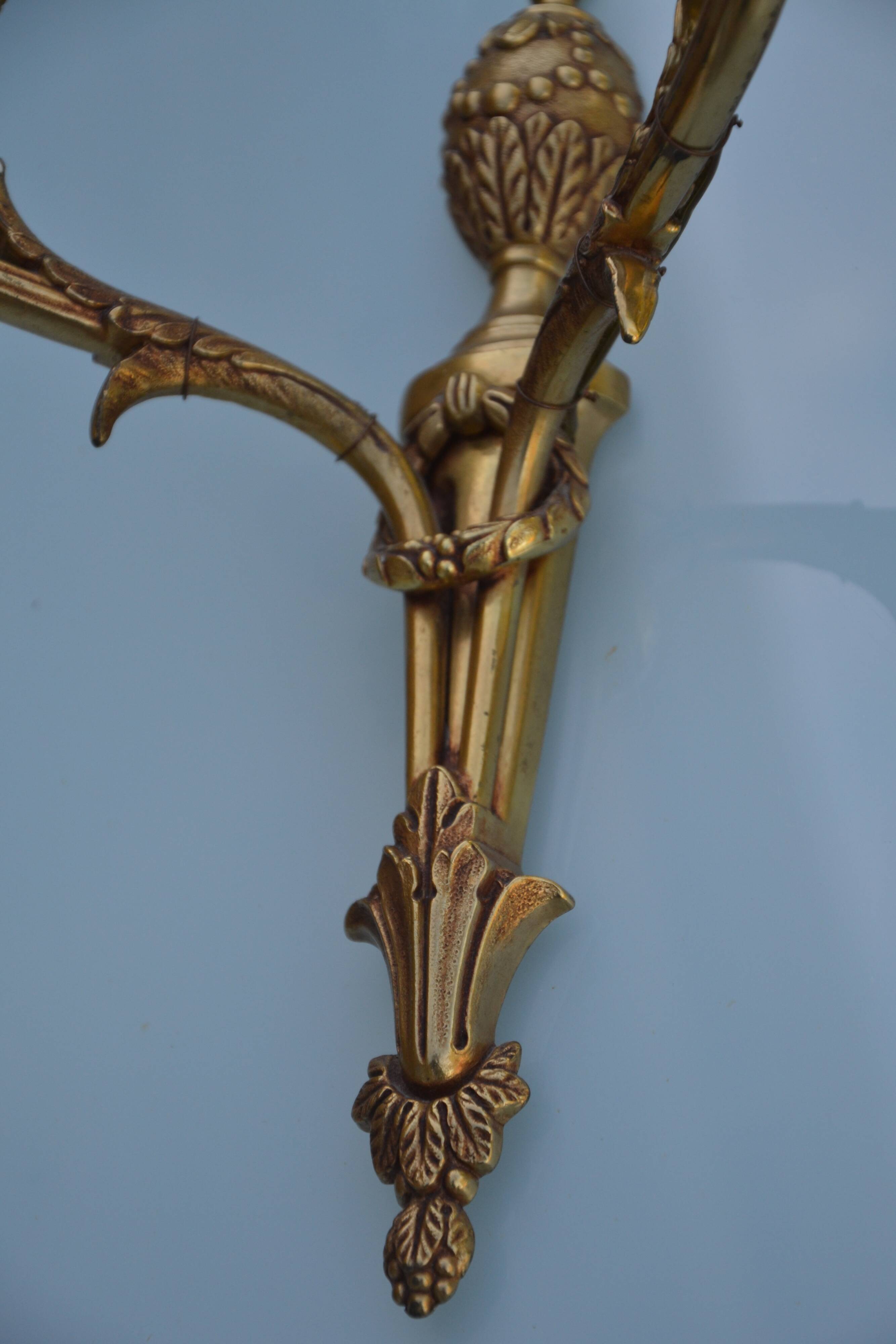 2 sculpted bronze wall lights