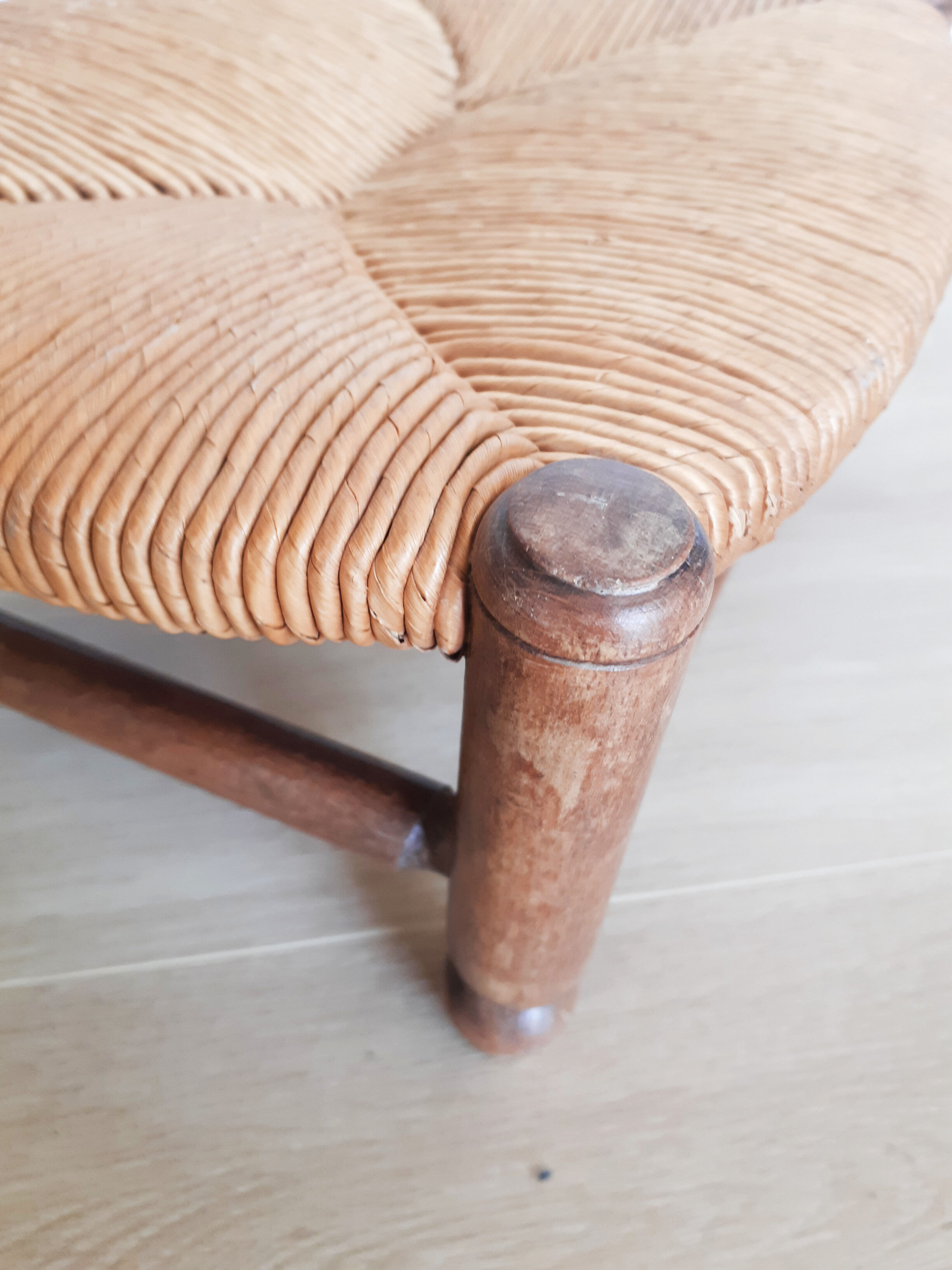 Low wooden stool and straw