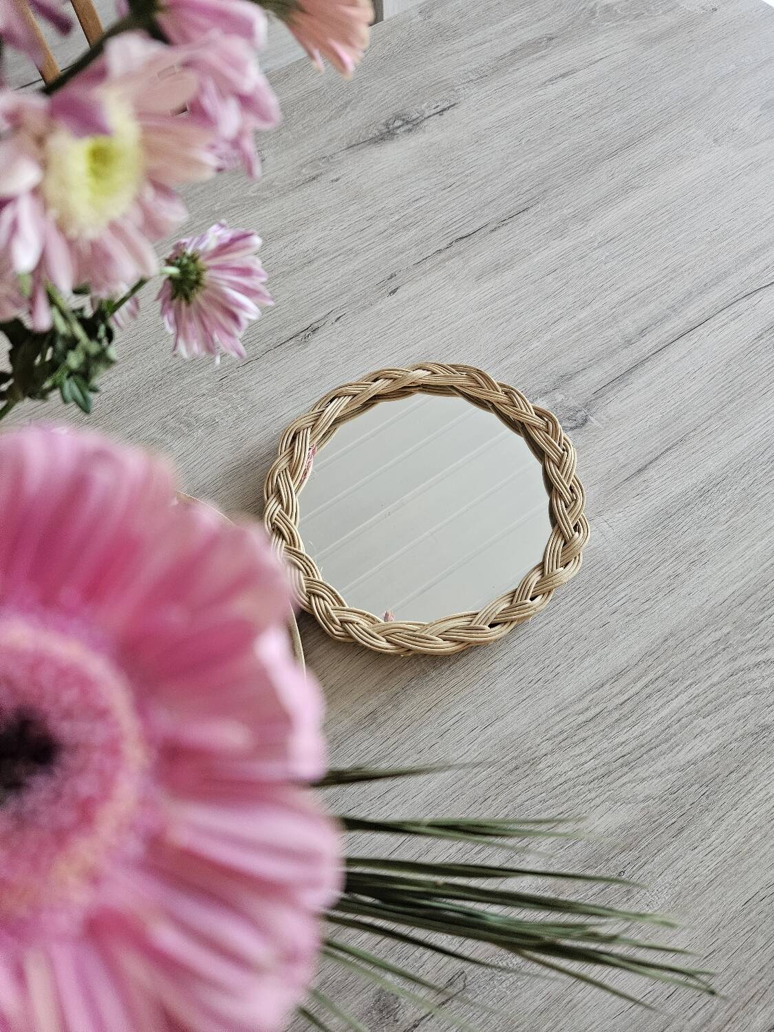 Old small round wicker mirror