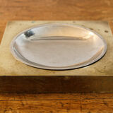 Picks up brass counter money