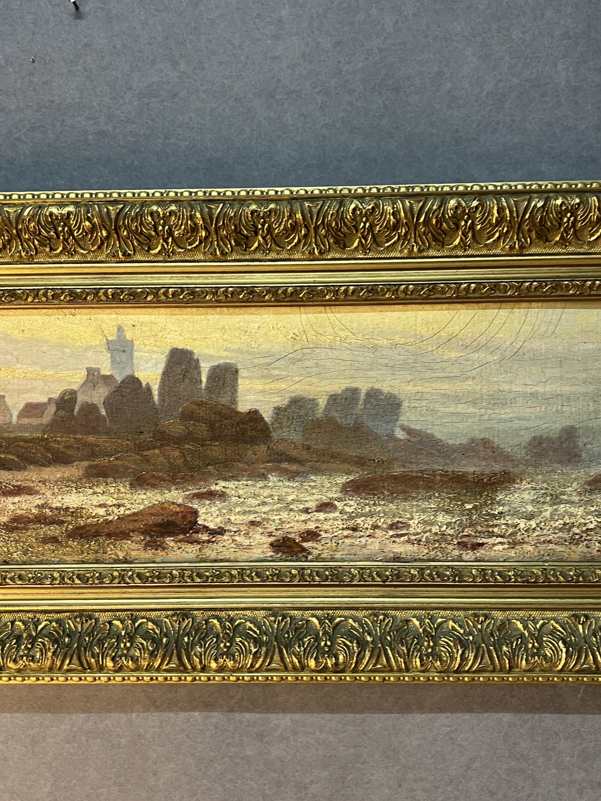 A. Laemmermann, oil painting on cardboard depicting a rocky landscape.