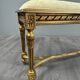 Antique gilded wooden bench in Louis XVI style, 19th century.