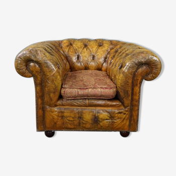 Patinated Chesterfield armchair