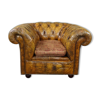 Fauteuil Chesterfield patiné