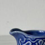 Old cream milk jug in slip