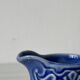 Old cream milk jug in slip