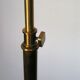 Articulated brass floor lamp