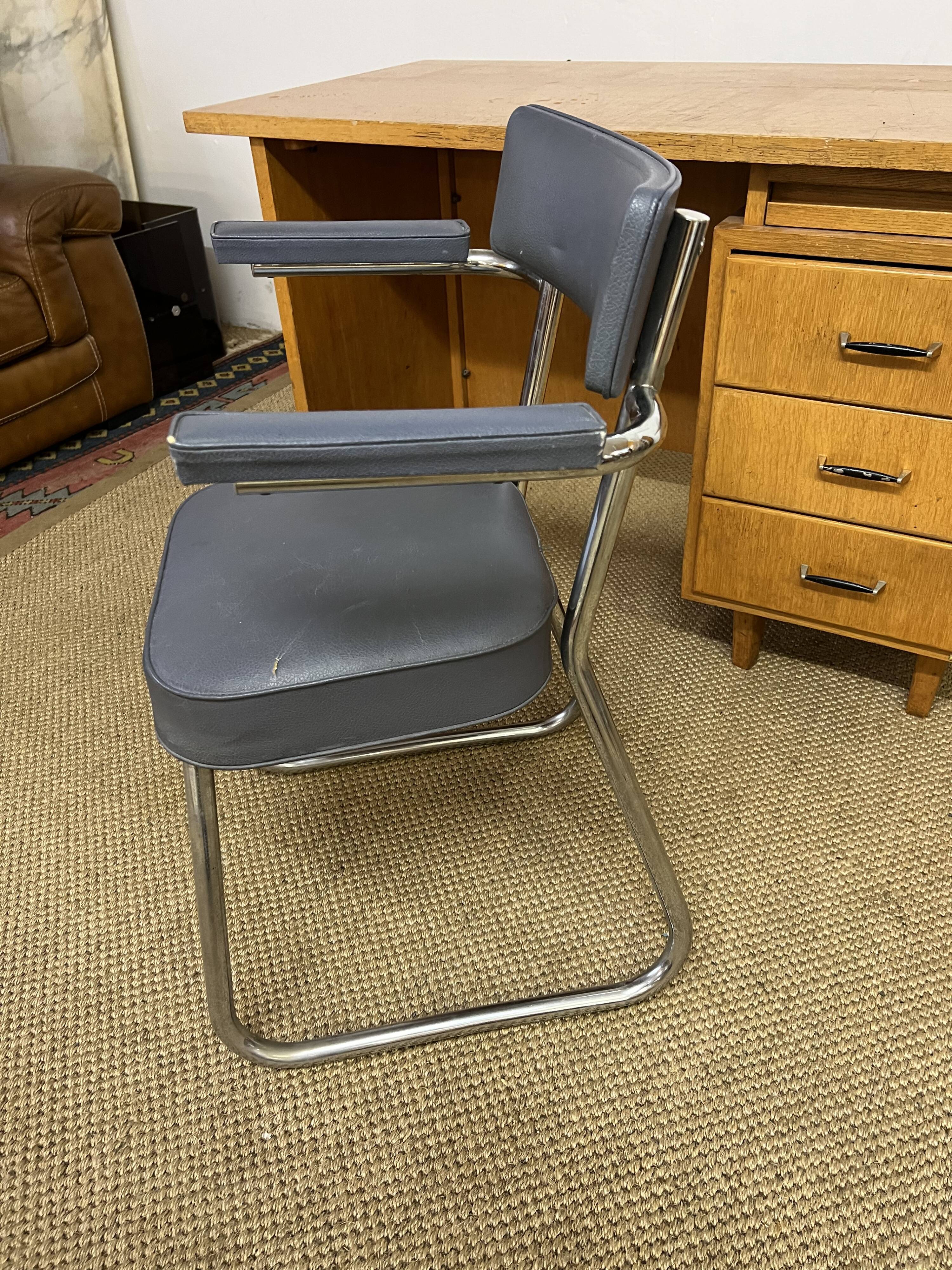Old wooden desk and armchair