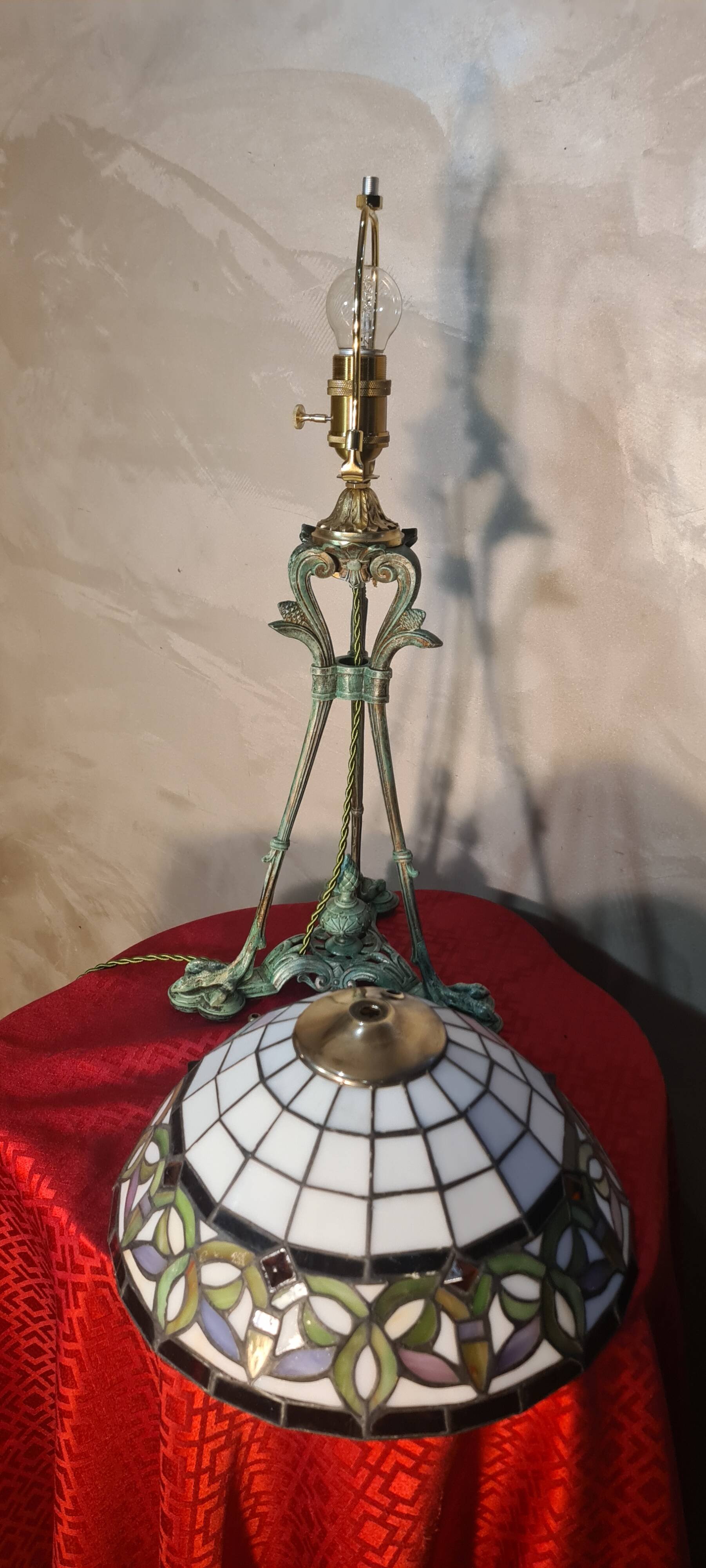 Antique patinated bronze regulator lamp with Tiffany glass shade in very good condition
