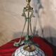 Antique patinated bronze regulator lamp with Tiffany glass shade in very good condition