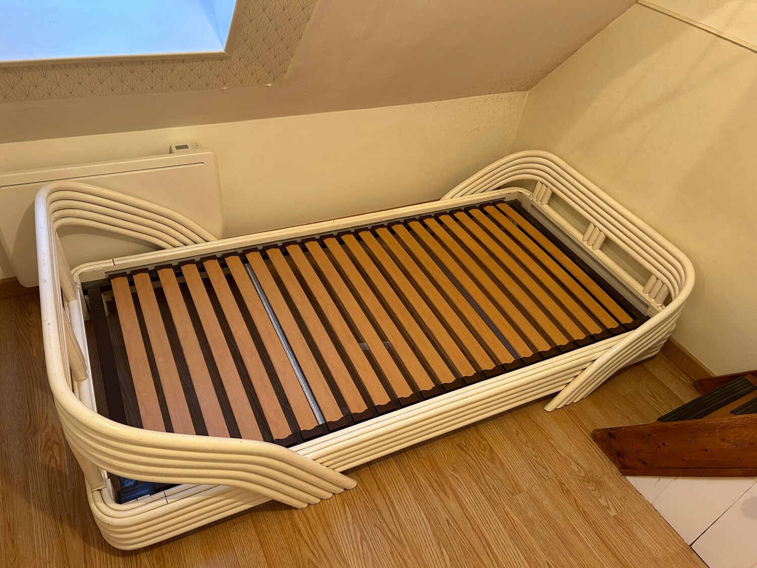 Vintage white rattan bed from the 1960s.