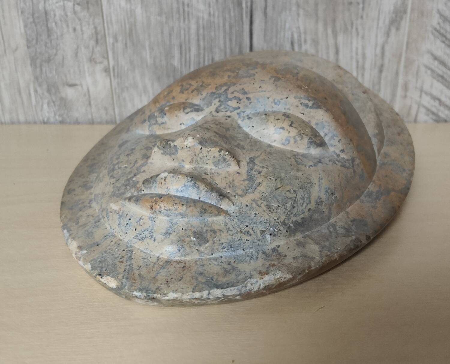 African stone face sculpture