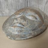 African stone face sculpture