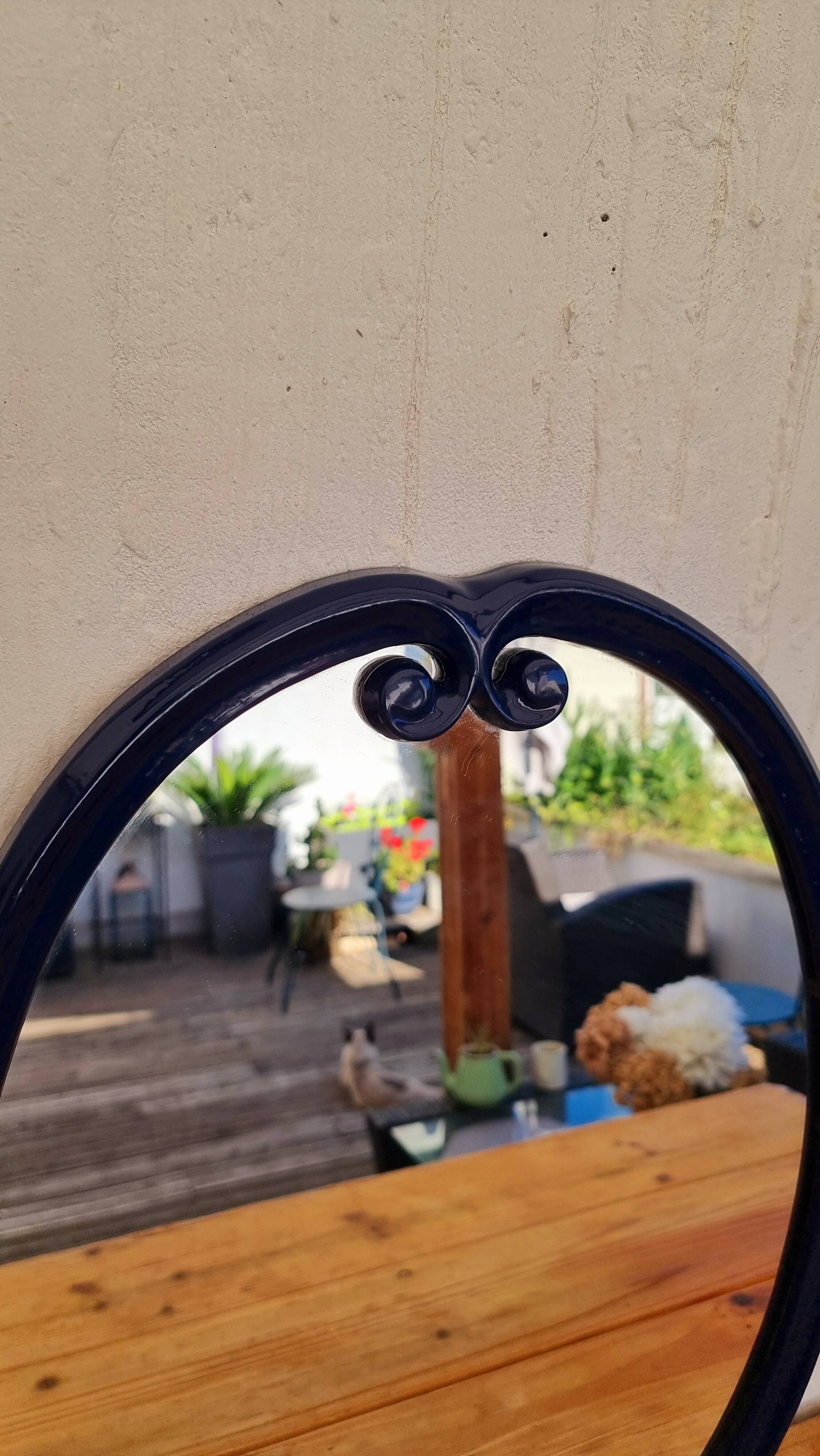 Vintage enameled blue oval mirror