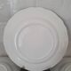 4 earthenware plates with floral and pastoral scene motif
