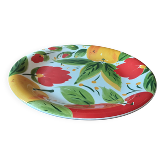 Quadrifoglio dish. Italian. Fruit and flower decoration. Shimmering colors.